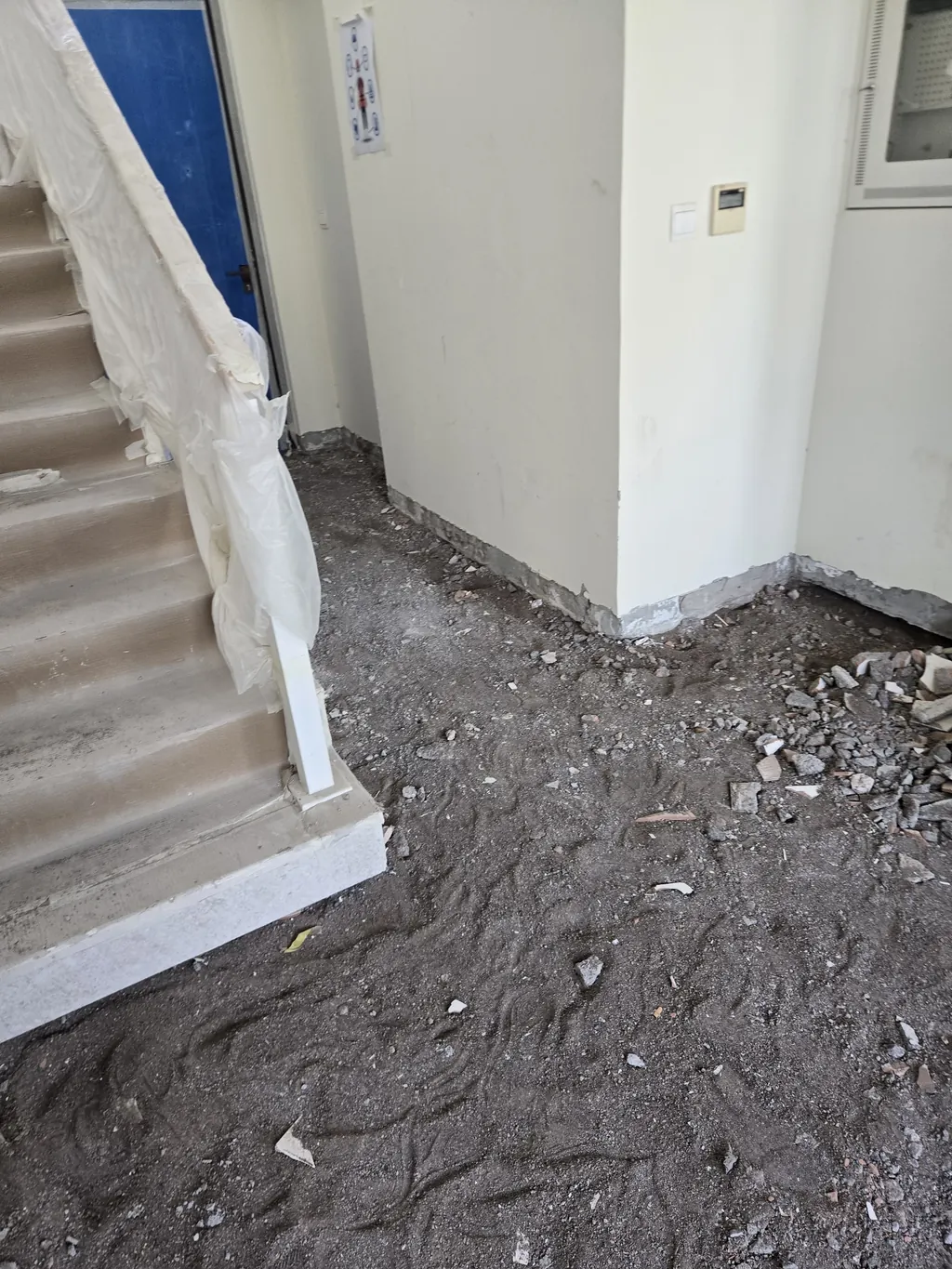 Stair hall with the old floor lifted down to the slab